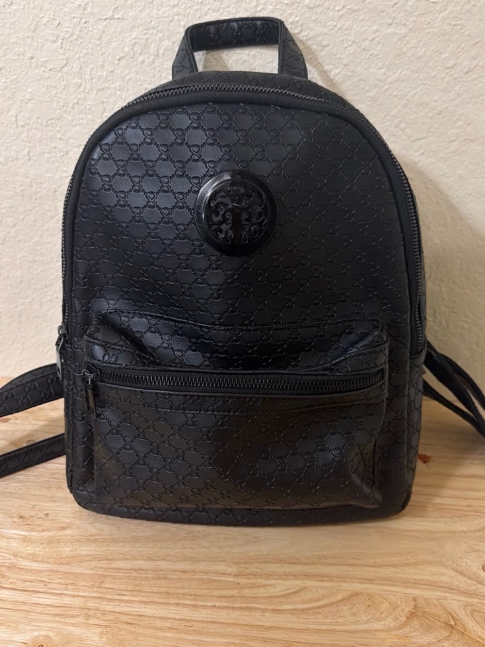 Compact Black Mini Backpack with Embossed Pattern - Picture 3 of 3